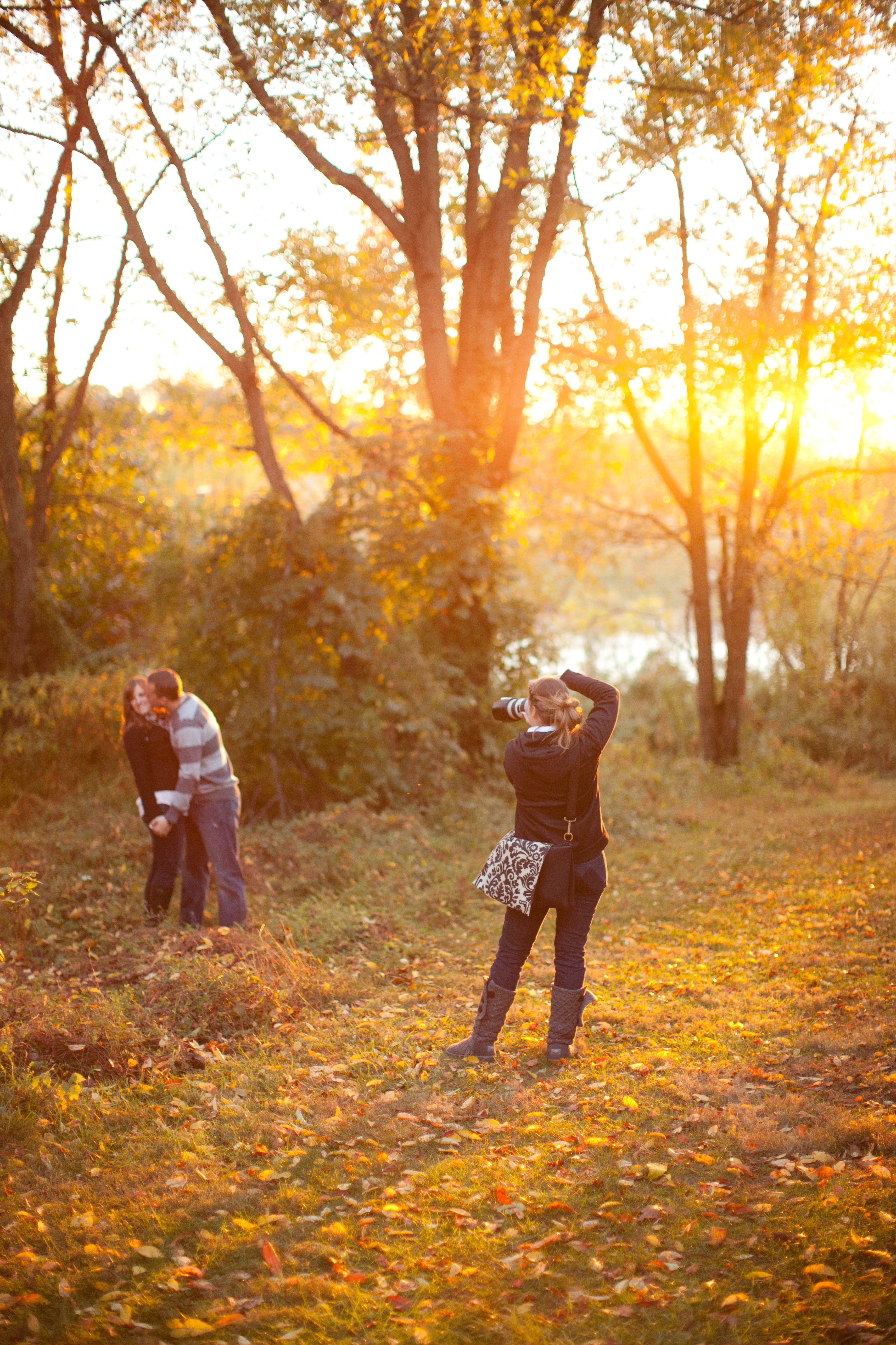 Liz photographing an engagement session at golden hour