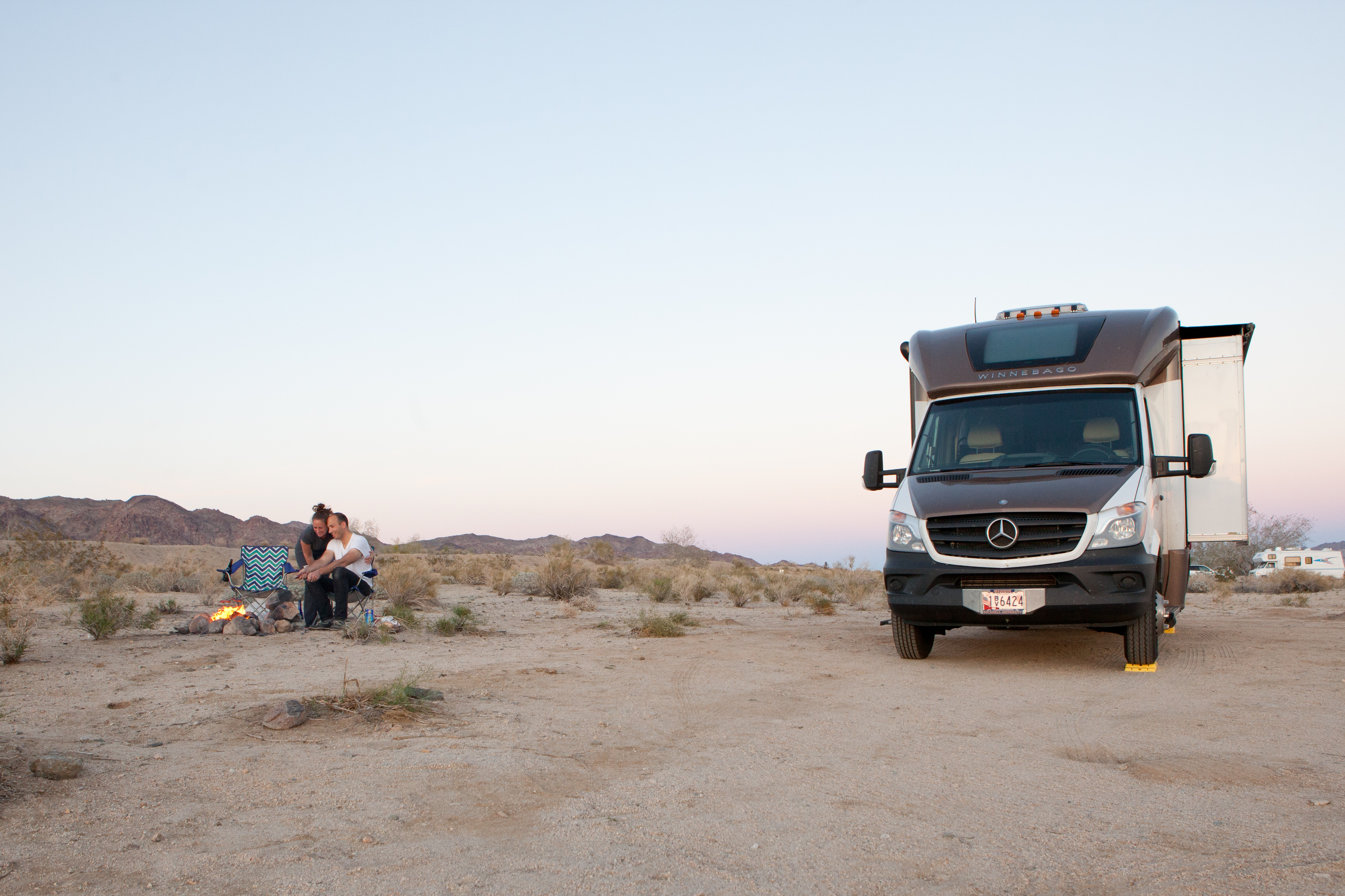 Liz and Ryan camping by their RV in Joshua Tree