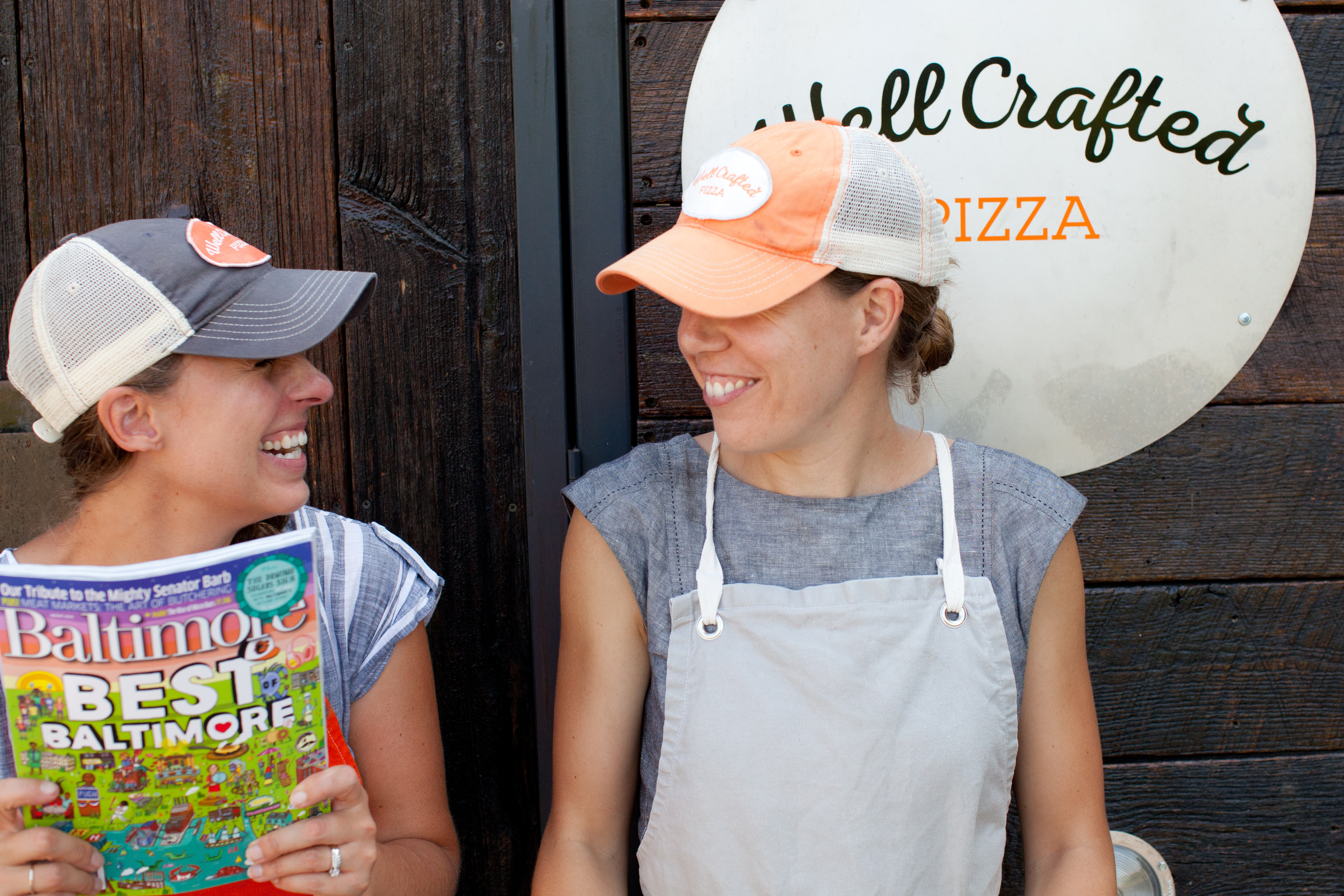 Liz and Laura celebrating Well Crafted Pizza in Baltimore Magazine