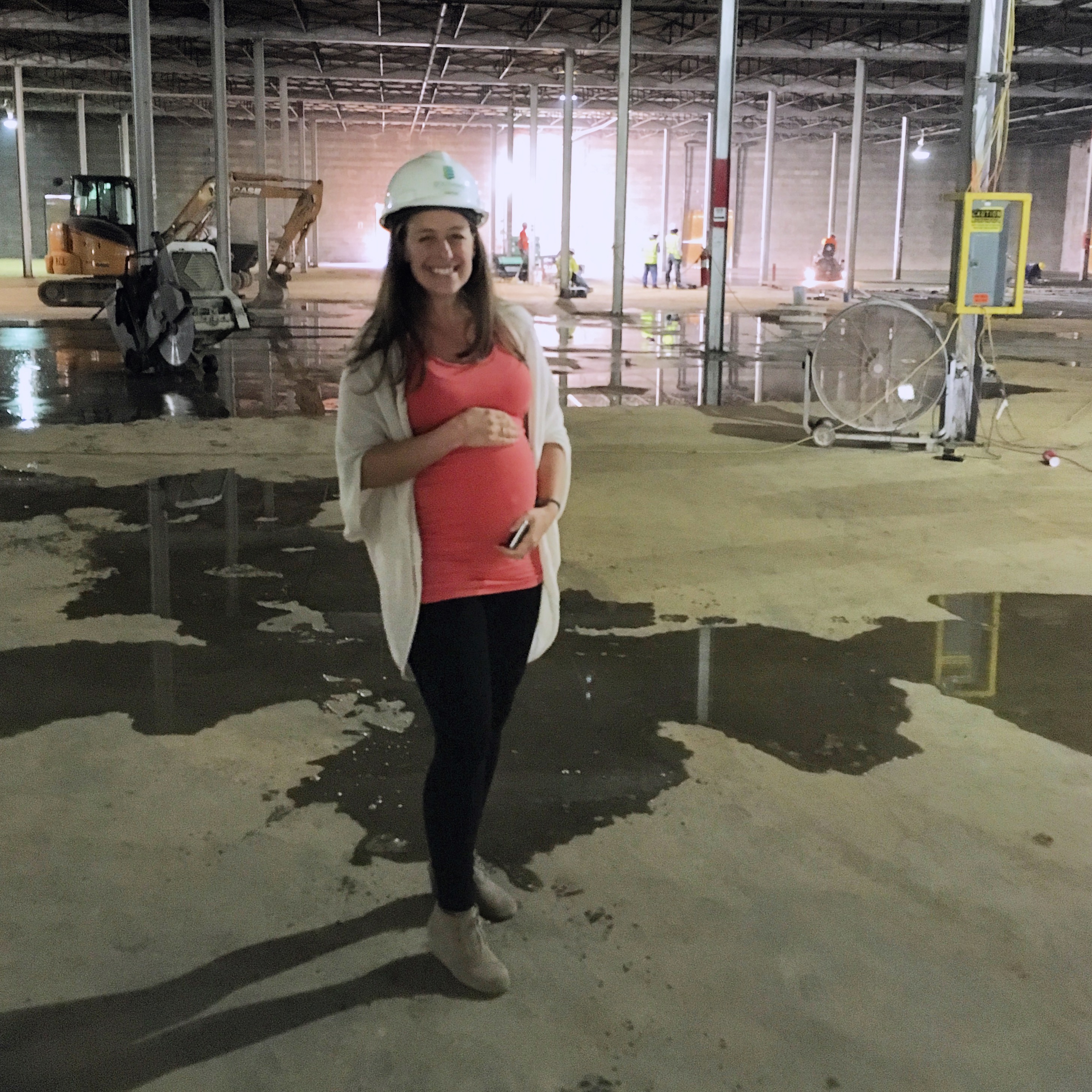 Liz at the Well Crafted Kitchen construction site while pregnant