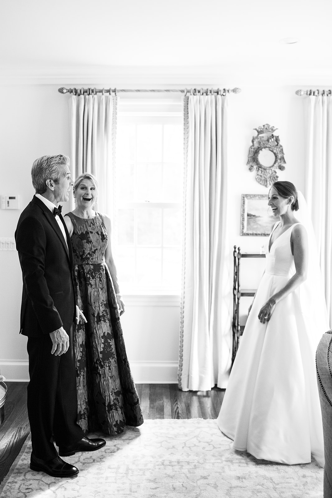 Bride's parents seeing her in her wedding gown