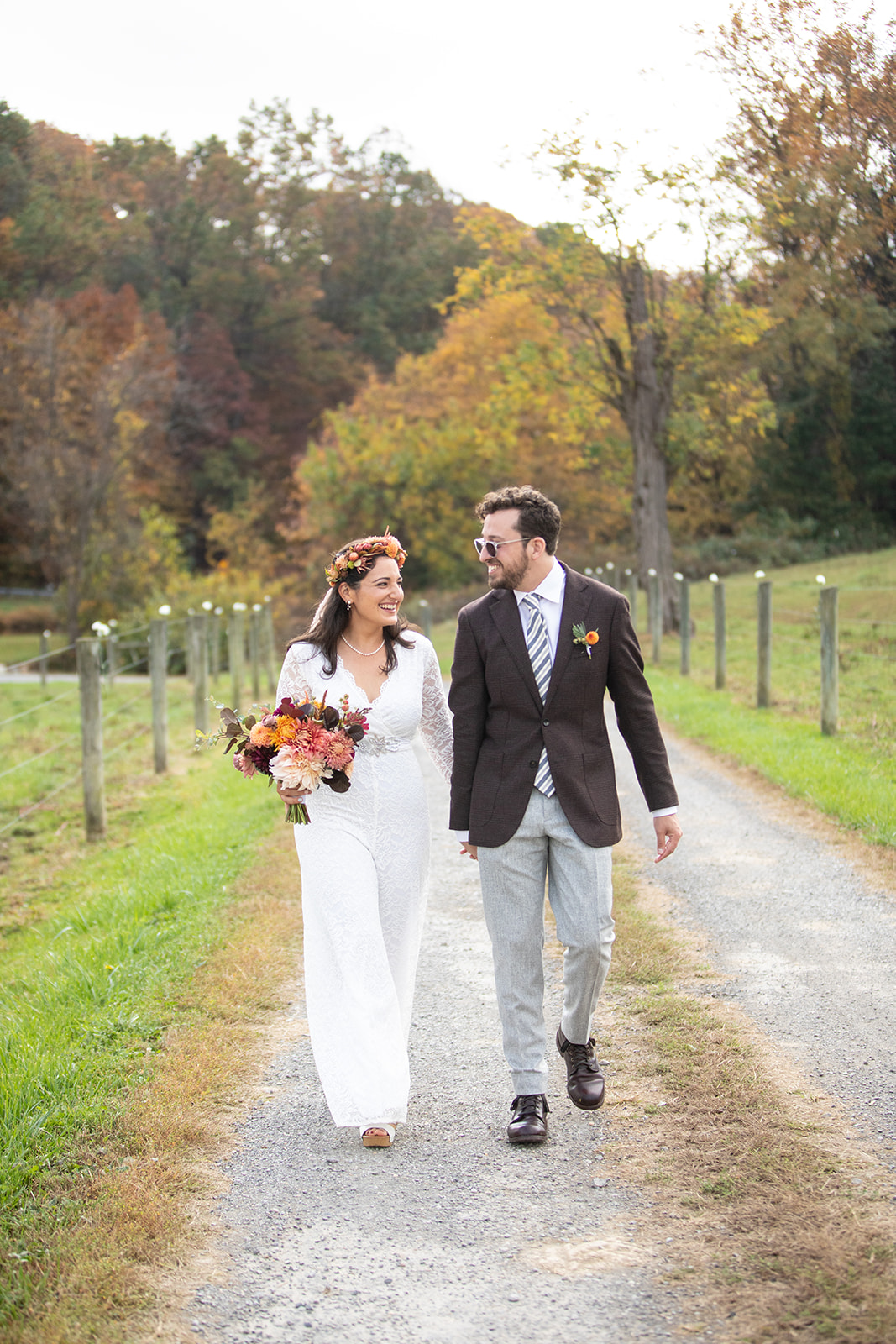 Bride laughing with flower crown on her wedding day