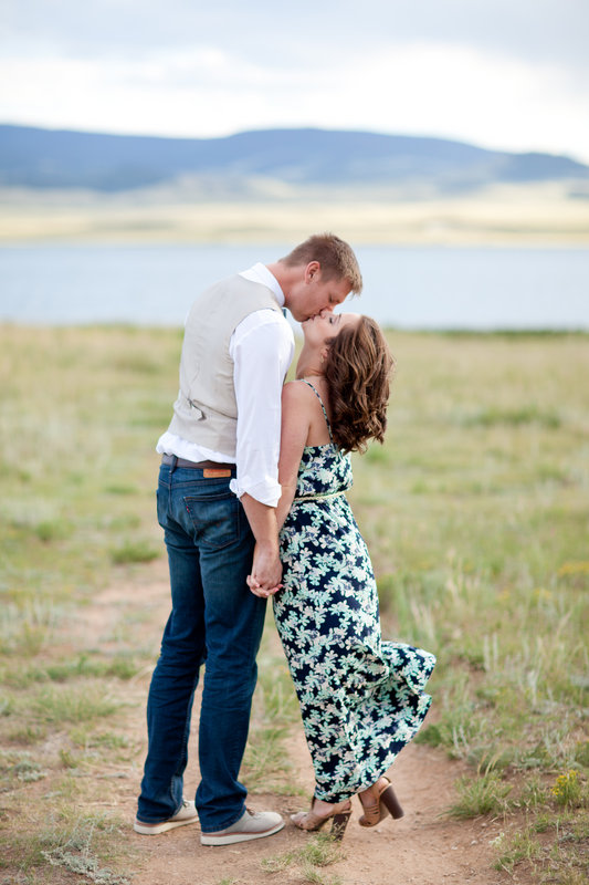 Jenna and Justin kissing by a lake